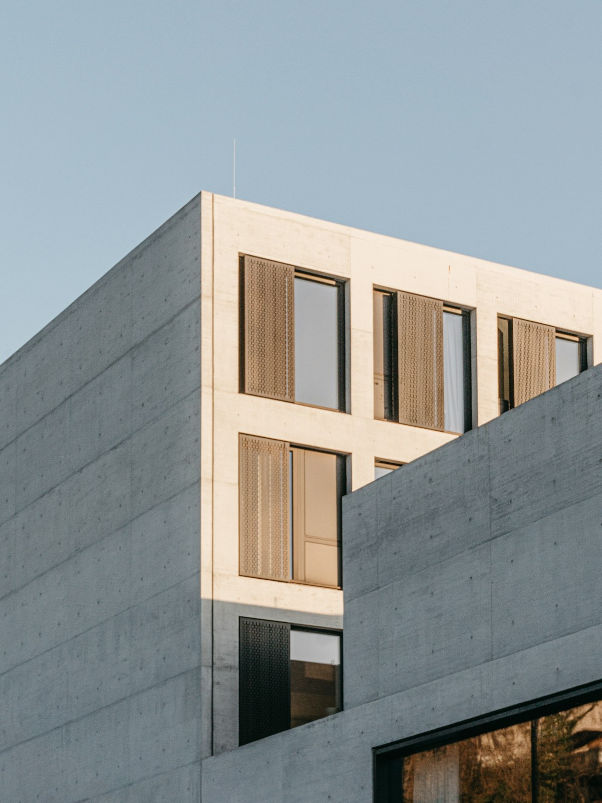 Concrete residential building façade under clear sky